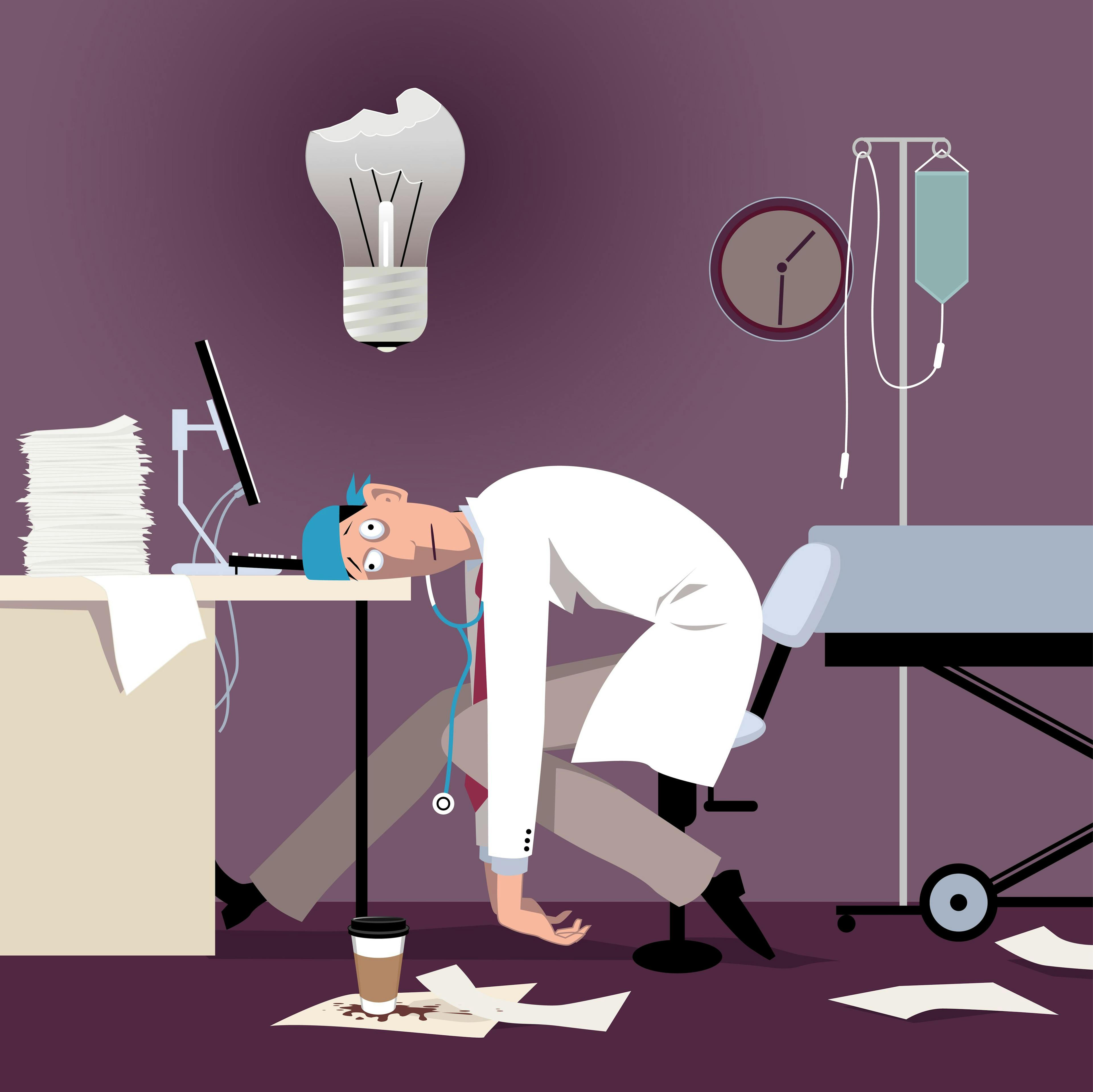 burnout doctor slumped at desk