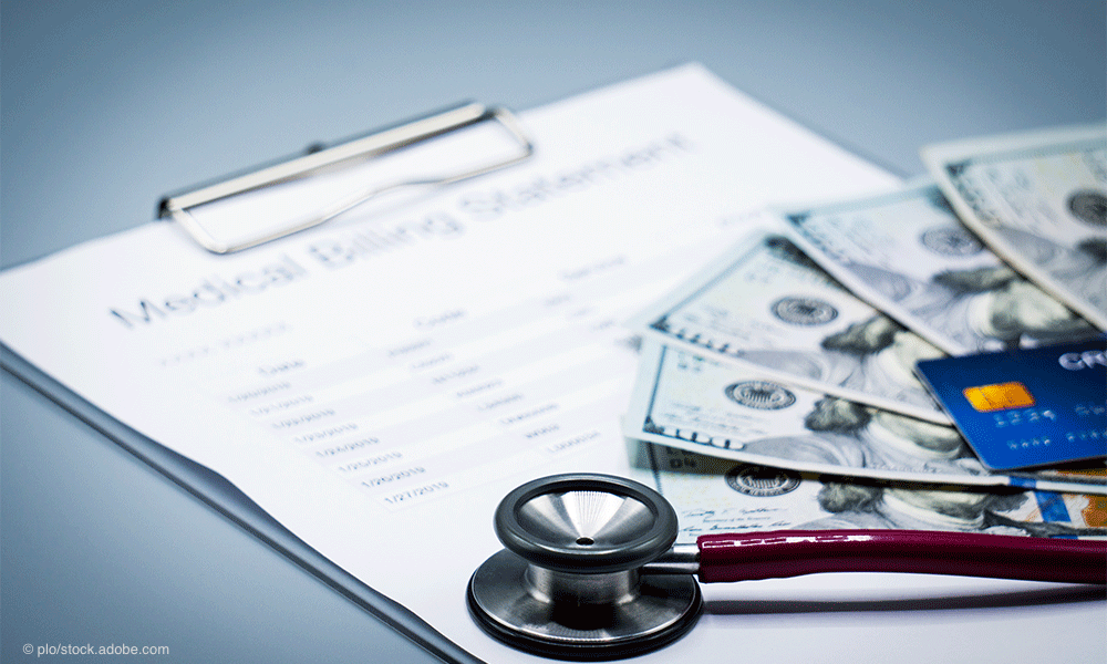 medical billing statement with cash, credit card, and stethoscope on top | © plo - stock.adobe.com