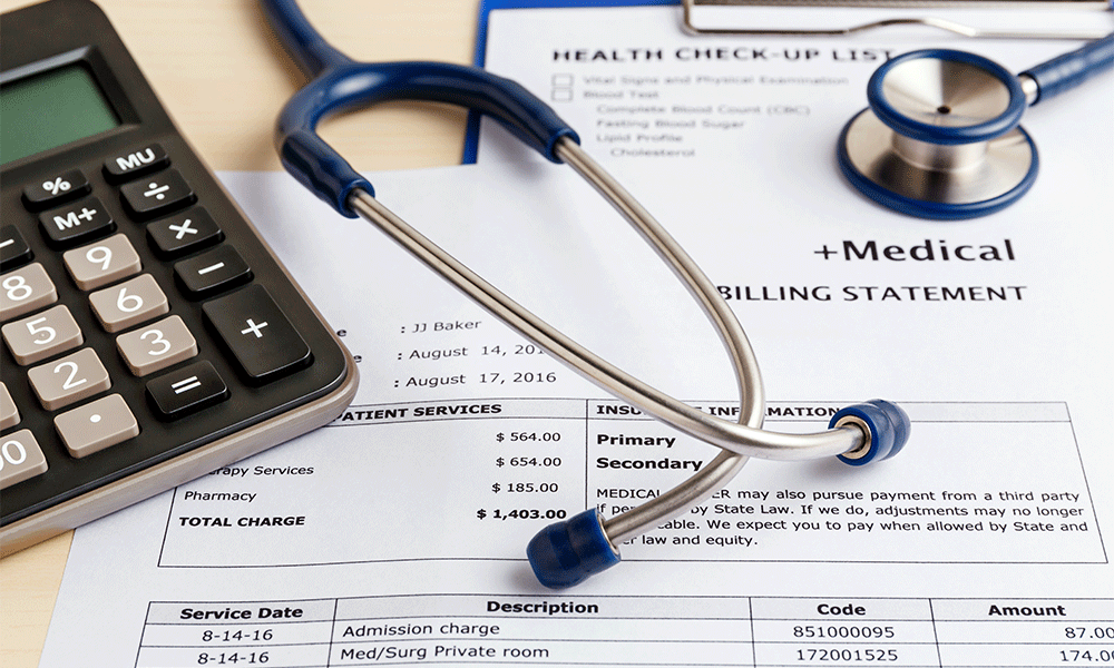 medical bills stethoscope and calculator
