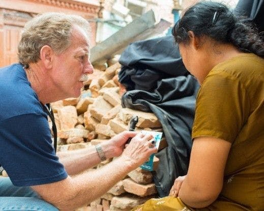 Don Pederson, Ph.D., PA-C provides care to a patient in Nepal