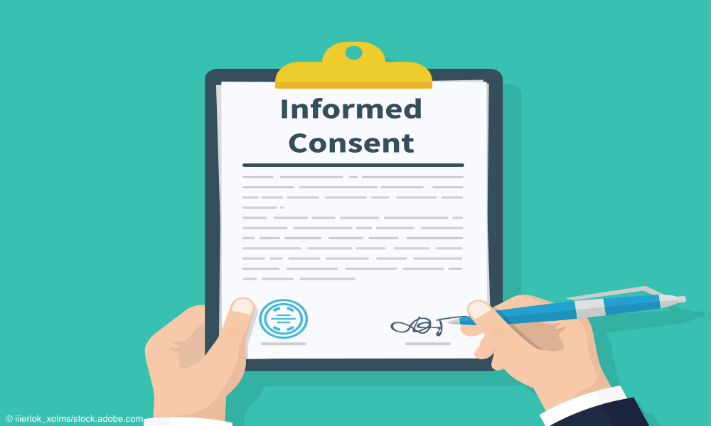 hands signing informed consent form