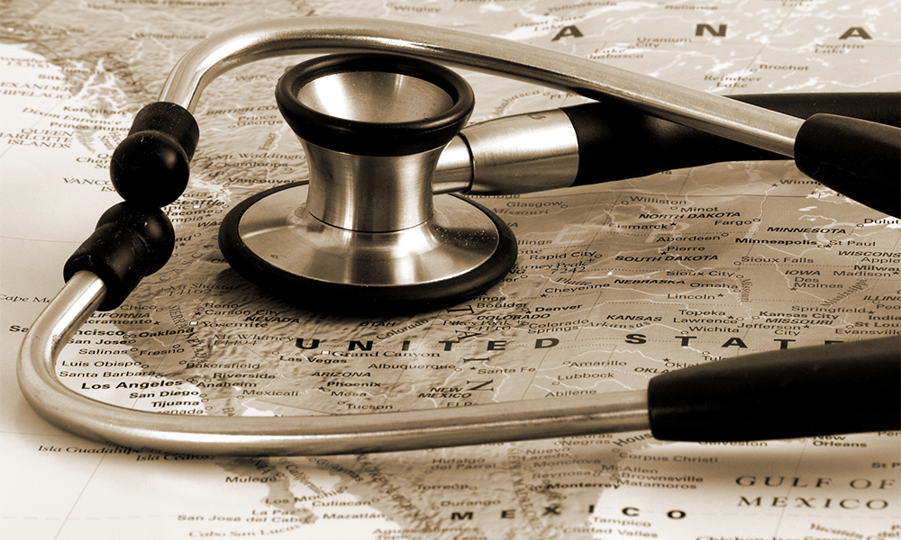 stethoscope laying on map of Canda United States and Mexico
